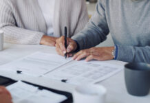 Cropped shot of a senior couple meeting with a consultant to discuss paperwork at home