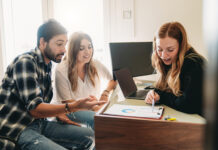 Diagram Your Distribution – Charting Assets Through the Estate Planning Process Financial advisor consultant is showing trends to the clients. They are in the office.